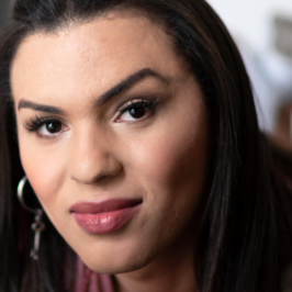 A Femme Latinx worker portrait with the quote "Given the disproportionate number of Black, Latinx, and Indigenous people who have been impacted by the criminal legal system, fair chance hiring reforms also represent an institutional commitment to racial and economic equity."