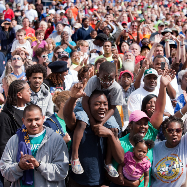 Large cheering crowd at a Labor Day event