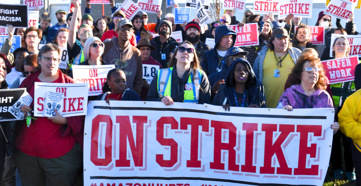 Large group of St. Louis Amazon workers demonstrate in an international Black Friday strike. Their signs read "On Strike #AmazonHurts #MakeAmazonPay".