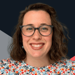 Headshot of 30-something white woman wearing glasses, smiling, looking directly at the camera.
