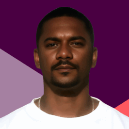 A portrait of a Black man wearing a white t-shirt. against a purple and coral angled background.