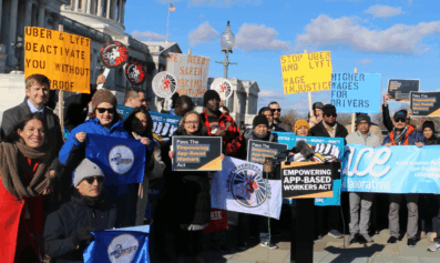 App-based workers and advocates gather at the U.S. Capitol holding signs and banners urging passage of the Empowering App‑Based Workers Act, calling for higher wages and increased transparency for workers.