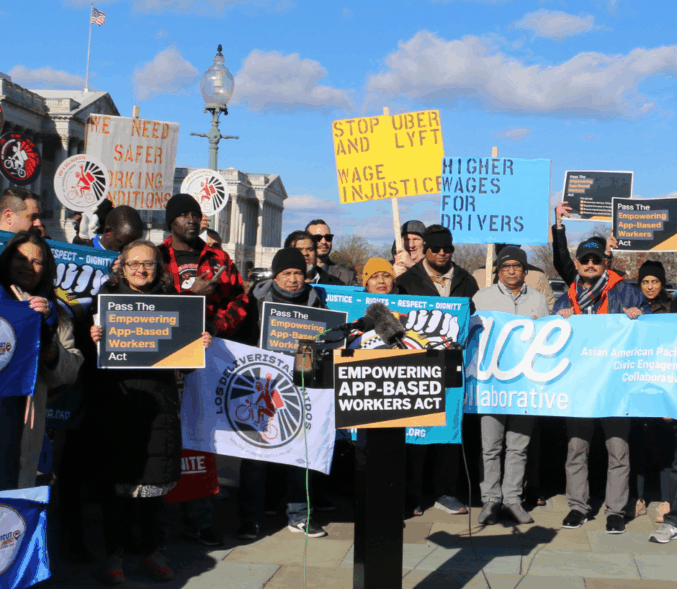 App-based workers and advocates gather at the U.S. Capitol holding signs and banners urging passage of the Empowering App‑Based Workers Act, calling for higher wages and increased transparency for workers.